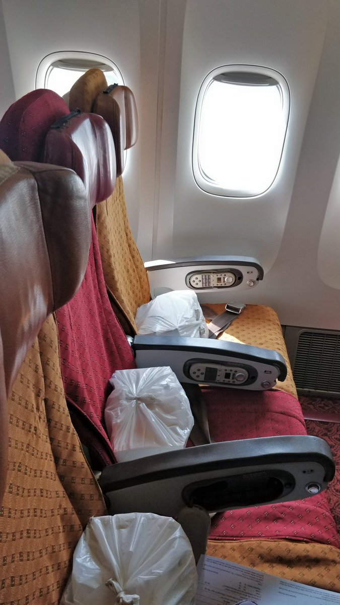 Boarded after 1.5 hours delay (as of now) due to problems in ticketing. Only 2/3rds of the plane has received protective equipment as of now. Two big boxes of packaged food and water placed on each seat.  #VandeBharatMission
