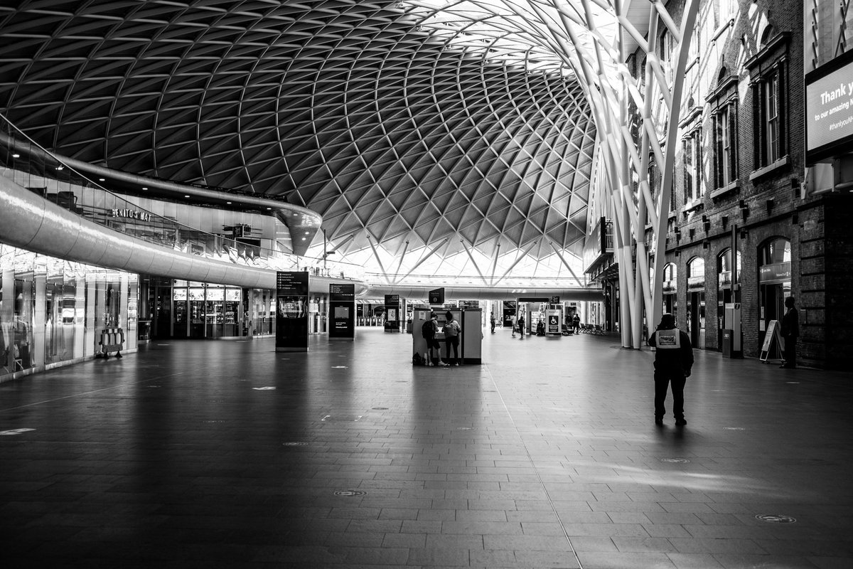 Kings Cross deserted in lockdown. A handful of trains are still running for key workers, but very few passengers milling around. All of the amenities are closed. And sadly like much of London, too many homeless sleepers.  https://www.instagram.com/sebastianepayne 