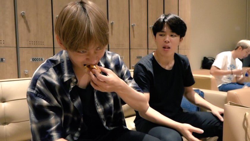 Jimin choking on his food while Taehyung is just-