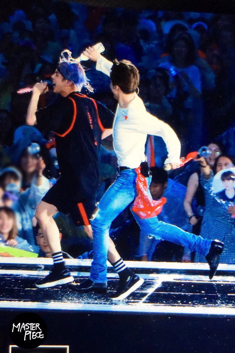 Jimin chasing Seokjin with a water bottle