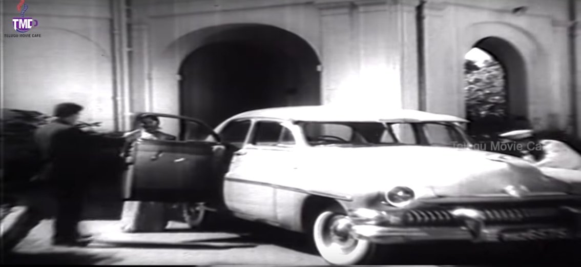 NTR seeing off Saroja Devi in a 1951 Mercury four door sedan with suicide rear doors(Dagudu Moothalu , 1964)