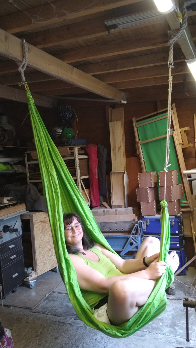 MoragHickman's tweet photo. Some small crafts today using discarded rigging from the Cutty Sark salvaged by @Benniff - spliced lines for hanging hammock/swing from the shed beams, and a hot-glued scrappy mat to keep @sam_cook's feet off the stone under his desk. https://t.co/9RNo3dHuYE