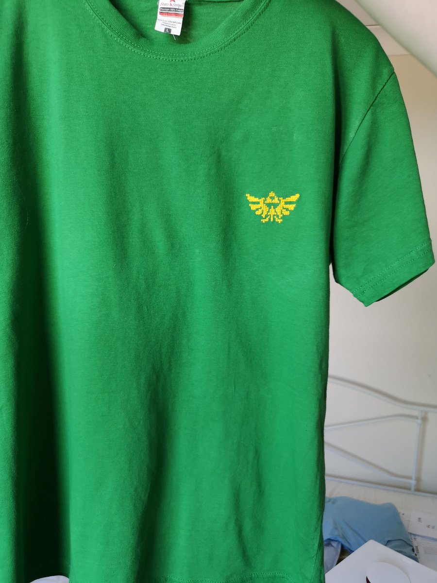 Hylian Crest on a green t-shirt!
