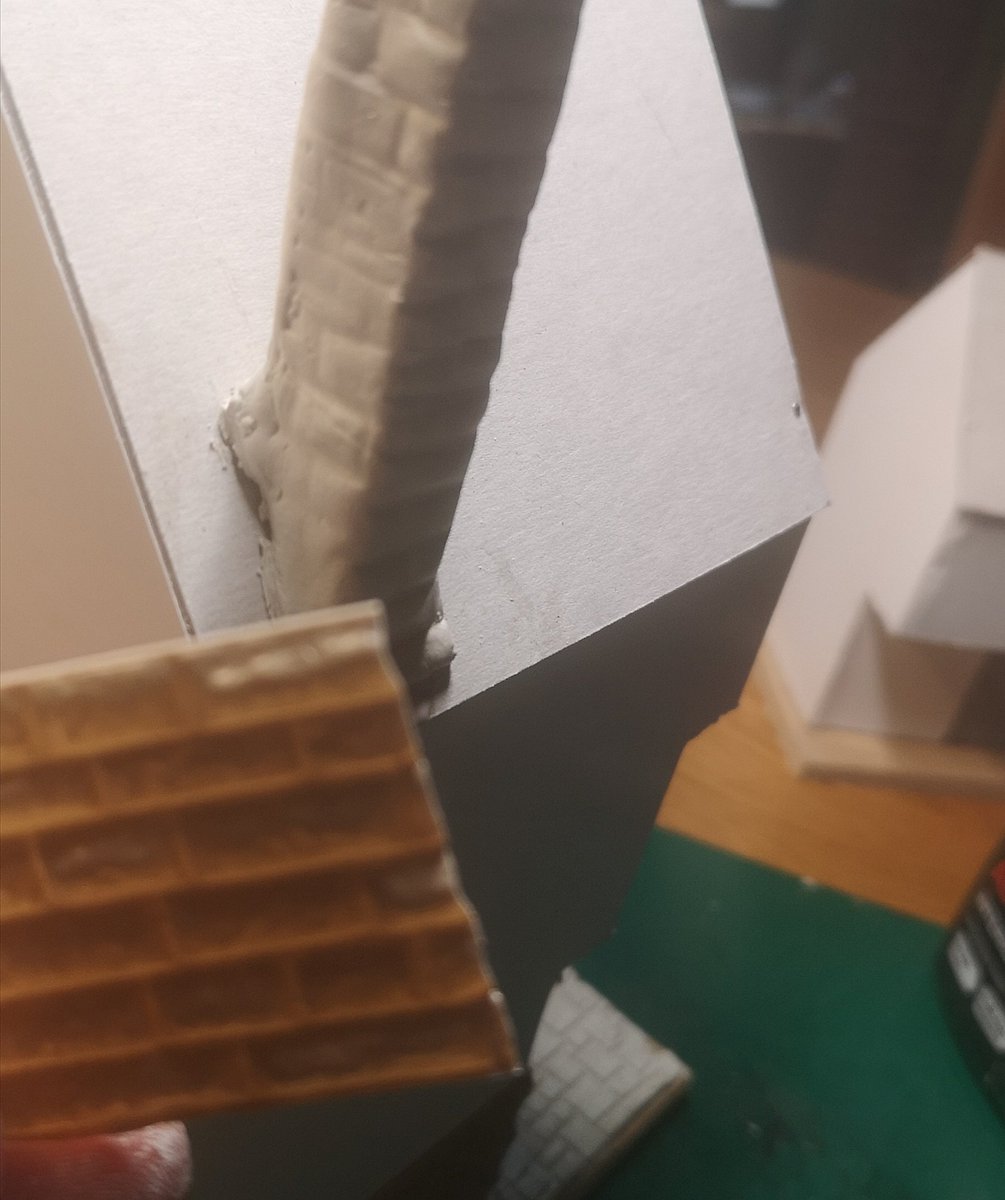 I made a simple chimney by sandwiching two pieces of foamcore together and wrapped them in Fimo clay, then I used a spare bit of the textured plasticard to imprint a stone texture #warmongers  #ttrpg