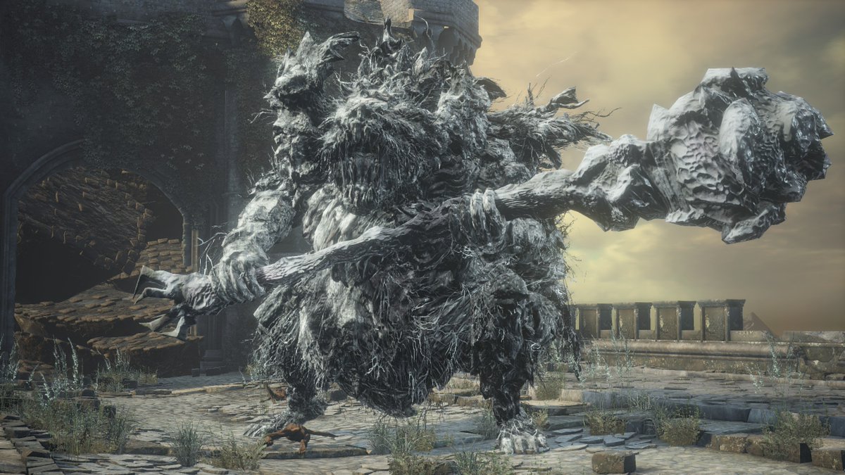 In Dark Souls 3, there's a Stray Demon on top of the bridge above Farr...