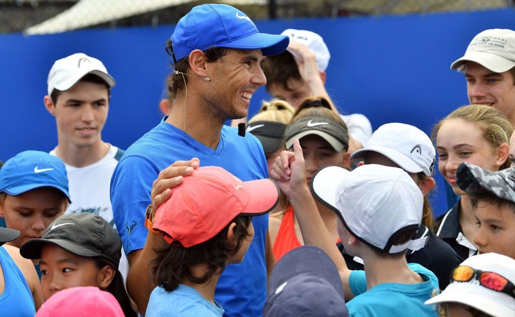 Before flying to Melbourne he holds a Tennis Clinic for kids.