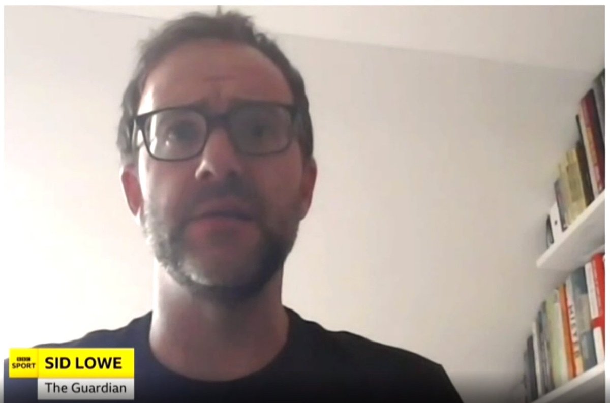 BCredibility's tweet photo. Sid Lowe. A mesmerising credibility grab that aligns Sid with knowledge beyond our physical realm. His books appear to slip through the veil, with half his shelves in whatever awaits us next. Sid sits on high, in a celestial glow, as close to heaven as mortal man can get. https://t.co/jYvI5UsL2F