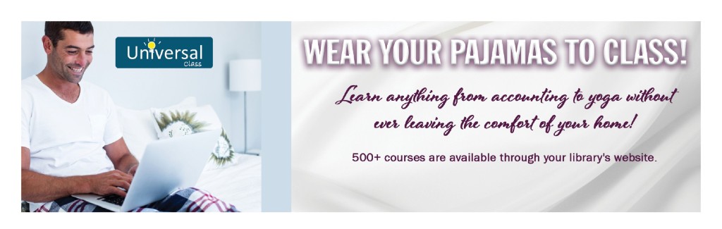 a man sitting on his couch looking down at a laptop smiling