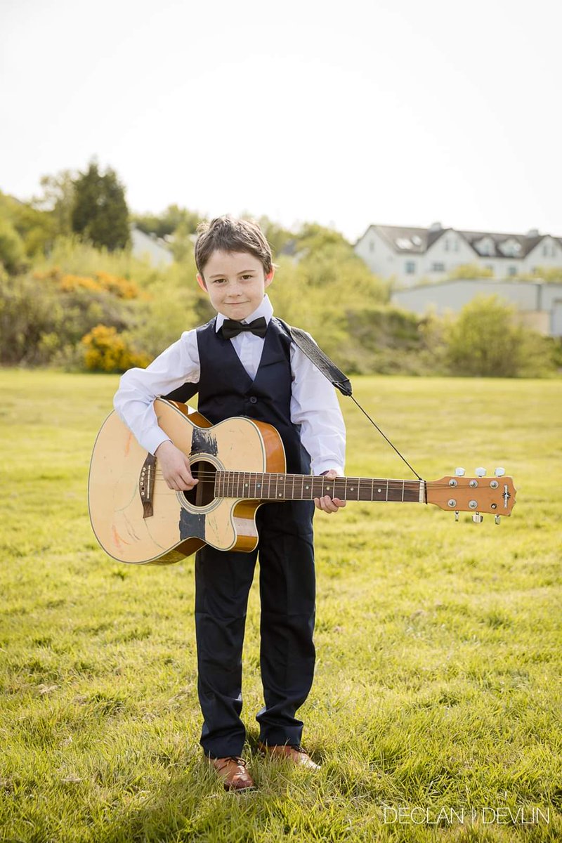 devlin_declan's tweet photo. Darragh, a huge Johnny Cash fan showing off his guitar in the Oldtown area of Letterkenny during covid 19 restrictions. 

#letterkennyportrait #CulturalHeritage @CulturalCentre https://t.co/iDnaqZHmdz