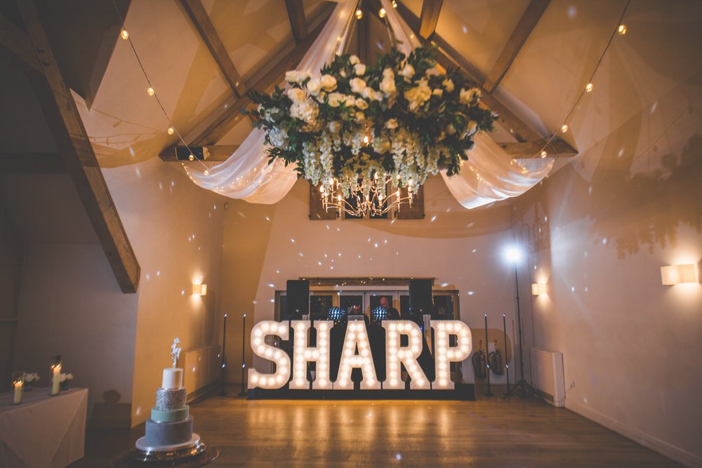 Huge congratulations to Natalie and Joe on their recent wedding at <a href="/HydeBarn/">Hyde House & Barn</a>! This was the last Wedding we had the absolute pleasure of styling with letter lights before lockdown commenced. Email hello@aislehireit.co.uk to talk through your wedding reception styling ideas! 💕💡