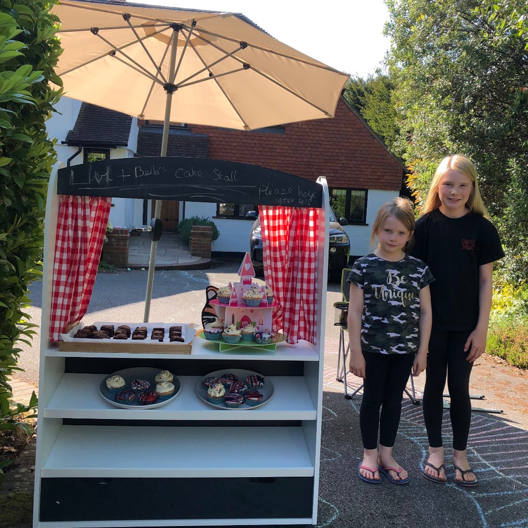 ManorHseSchool's tweet photo. Sisters, Bella and Olivia outside their house giving away their homebaked cakes for #75thVEDayAnniversary - fantastic community spirit and a great example of #OurMHSCommunity #manorhouseschool #Bookham They looked delicious! #PrepSchool #PrivateGirlsSchool #SurreyGirlsSchool https://t.co/Jzchxjc3Zc