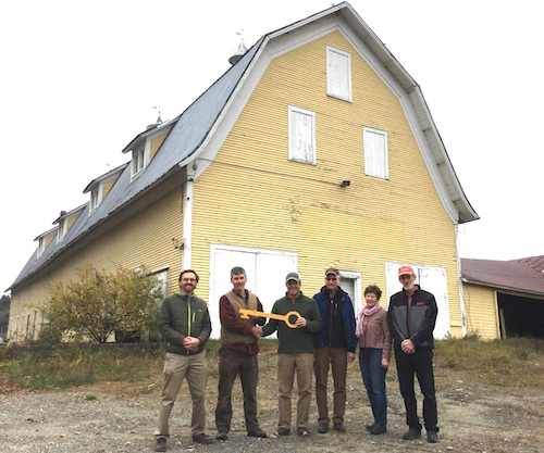 preservationvt's tweet photo. The iconic Yellow Barn in #HardwickVT is being revitalized with help from an NBRC/PTV grant. The adaptive reuse of the historic barn will house a retail outlet for @Cabot Creamery and showcase the region’s cheesemakers. #VTCheese #historicpreservation #Vermont https://t.co/B38PxMGcyK