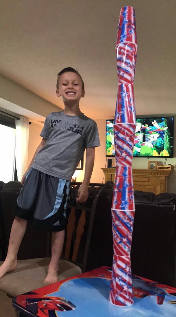 SMFSchools's tweet photo. Caiden is keeping his heart rate pumping with some strategic cup stacking! Look at the size of that tower! #MoveItMonday 
#BulldogPrideOnline #VirtualSMFSpiritWeek https://t.co/K6oeBAaKAa