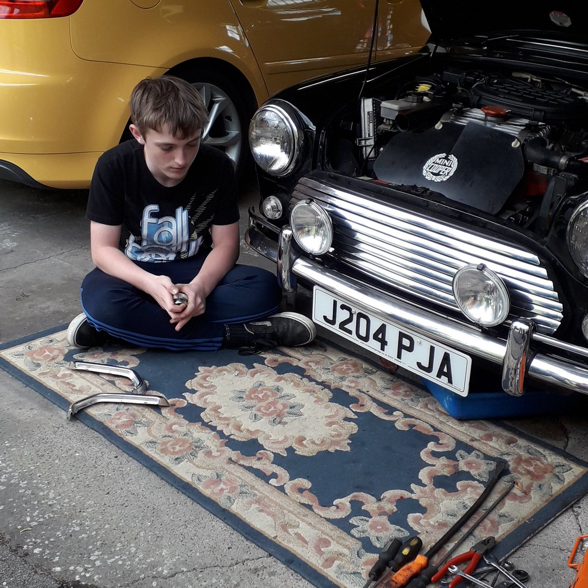 Emma76838511's tweet photo. @jamesmartinchef loving the red mini and your episode in the Lakes.  Made us smile as it always rains for us in Lakes. My son fixing our Mini. https://t.co/cXprFaDgW3