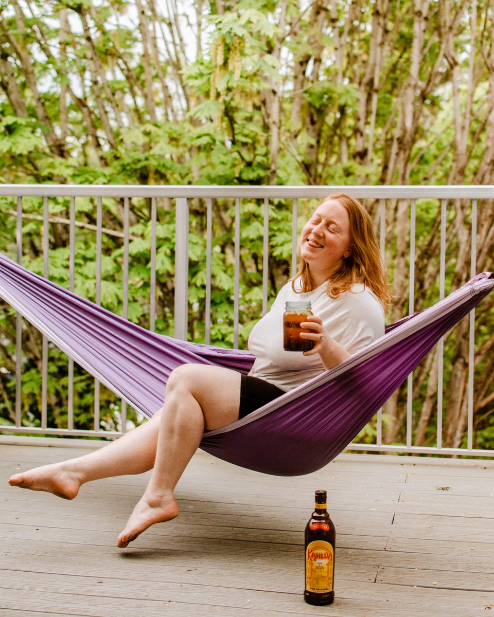 KPeetza's tweet photo. #ad âïžHanging outâïž So happy that it is finally warm enough to enjoy the sun here in Seattle! Set my hammock up and had a little brunch date with myself and a @kahlua Cold Brew Soda! #kahluapartner https://t.co/YuGJI3nQ3U