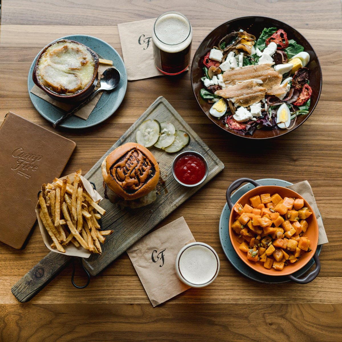 HotelSaranac's tweet photo. We really, really can't wait to get back to the classic #Adirondack flavors at #CampfireADK. 🍔🍻 For now, Campfire remains closed as we continue to adhere to state &amp; local guidelines to keep our guests &amp; staff safe. We're already excited to welcome you back again soon! #hotsara https://t.co/DwhQsPft3E