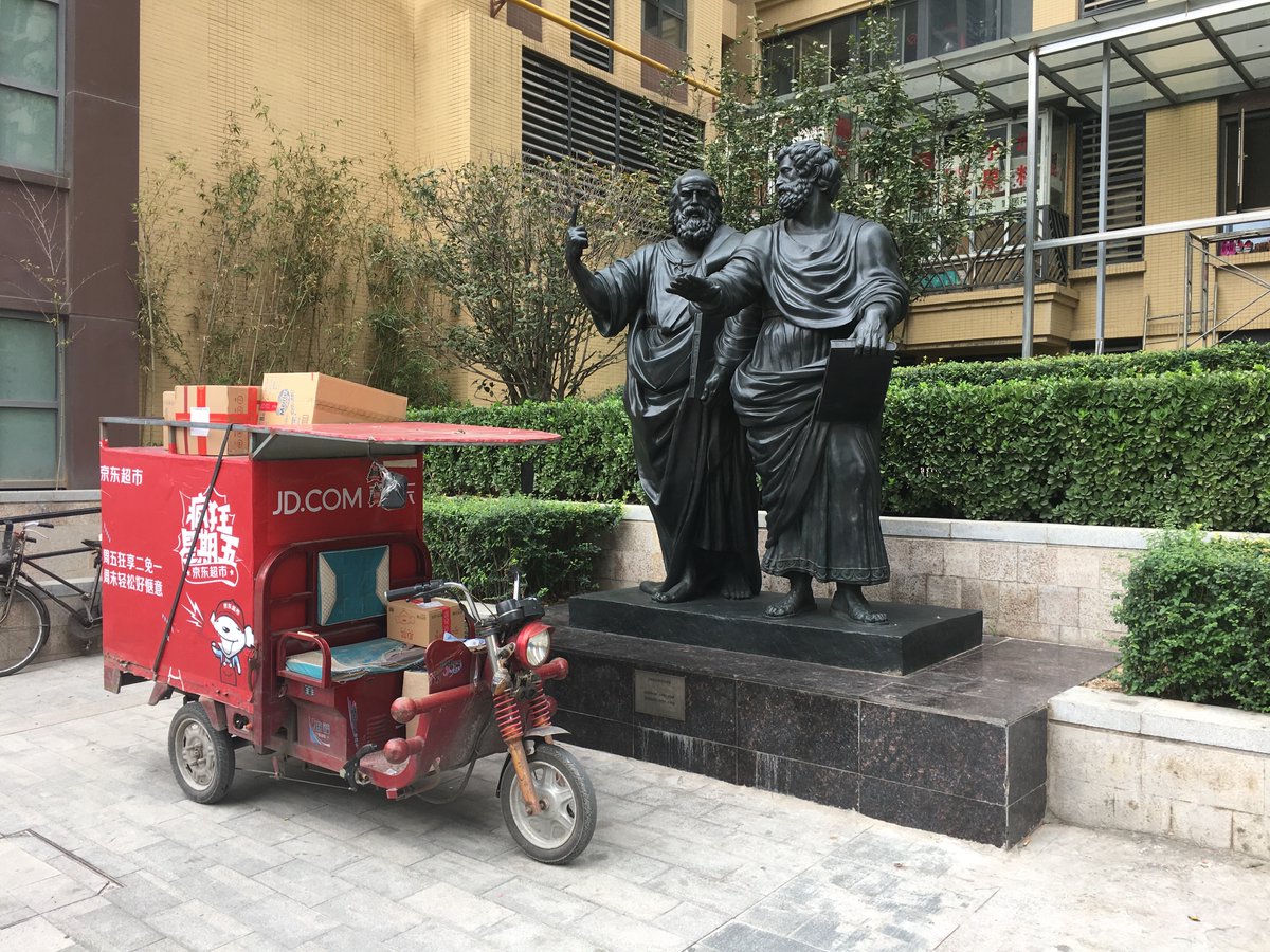 China pic, day 16:Plato and Aristotle debate the merits of JD deliveries, Xi'an, 2015. My friend's 小区 in Xi'an signaled it's lofty ambitions by building statues of famous philosophers all around the exterior.