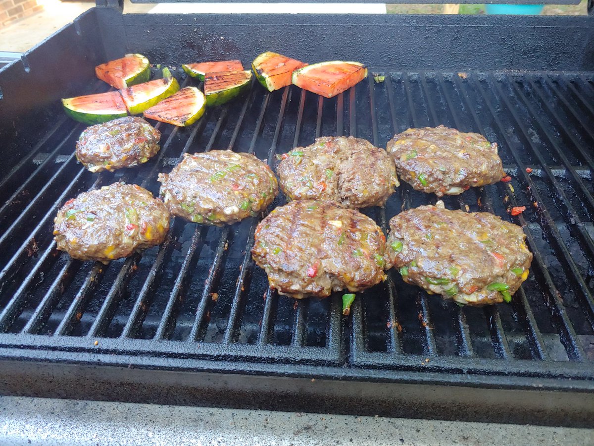 ChrisSanders253's tweet photo. Bison burgers stuffed with sharp cheddar, serano peppers, onions, and my secret blend of seasonings.  Grilled water melon for dessert! https://t.co/YWw3veCUtd