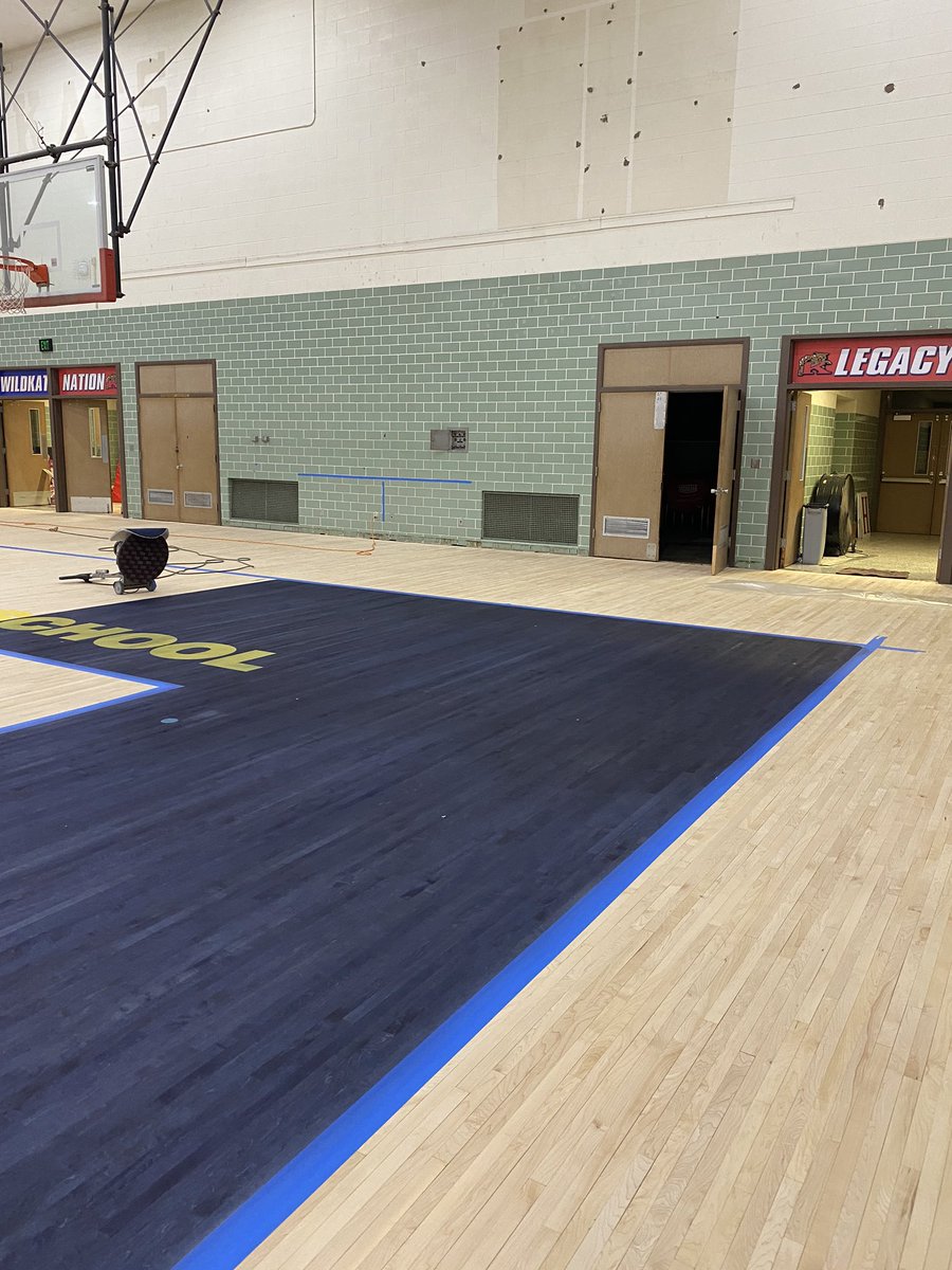 The stain going down on the historic Haworth Gymnasium! This will be a dedicated volleyball court for the lady KATS! #legacymatters