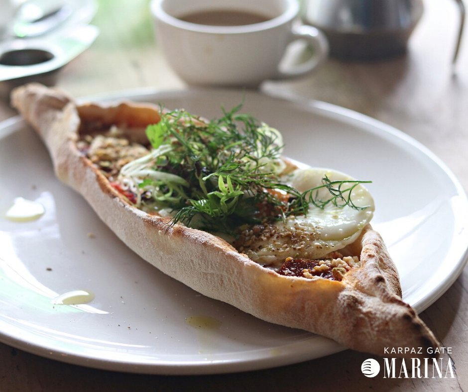 KarpazGate's tweet photo. We've been prepping for the #summer season and created lots of new yummy dishes for you to try. We have our brand-new #pizza & Turkish pide menu which includes our homemade traditional Turkish flatbread served with fresh toppings and with seasonal greens. #Turkishpide #yummy https://t.co/bCP8wiFjbY
