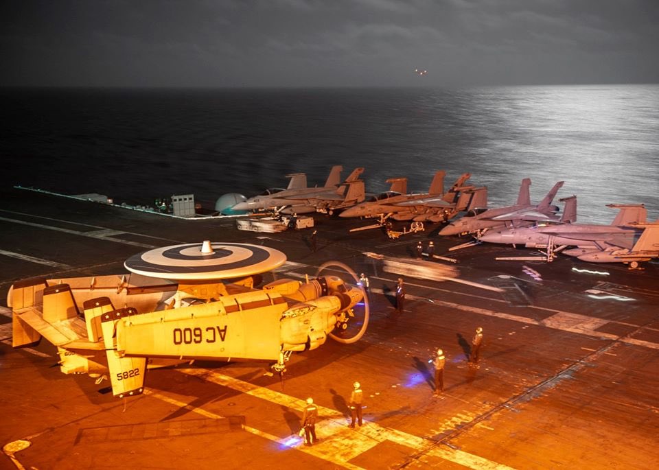 Sleepless at Sea. Sailors from #VAW123 Screwtops work late into the night on the flight deck of @TheCVN69. What a beautiful moonlit night to fly!