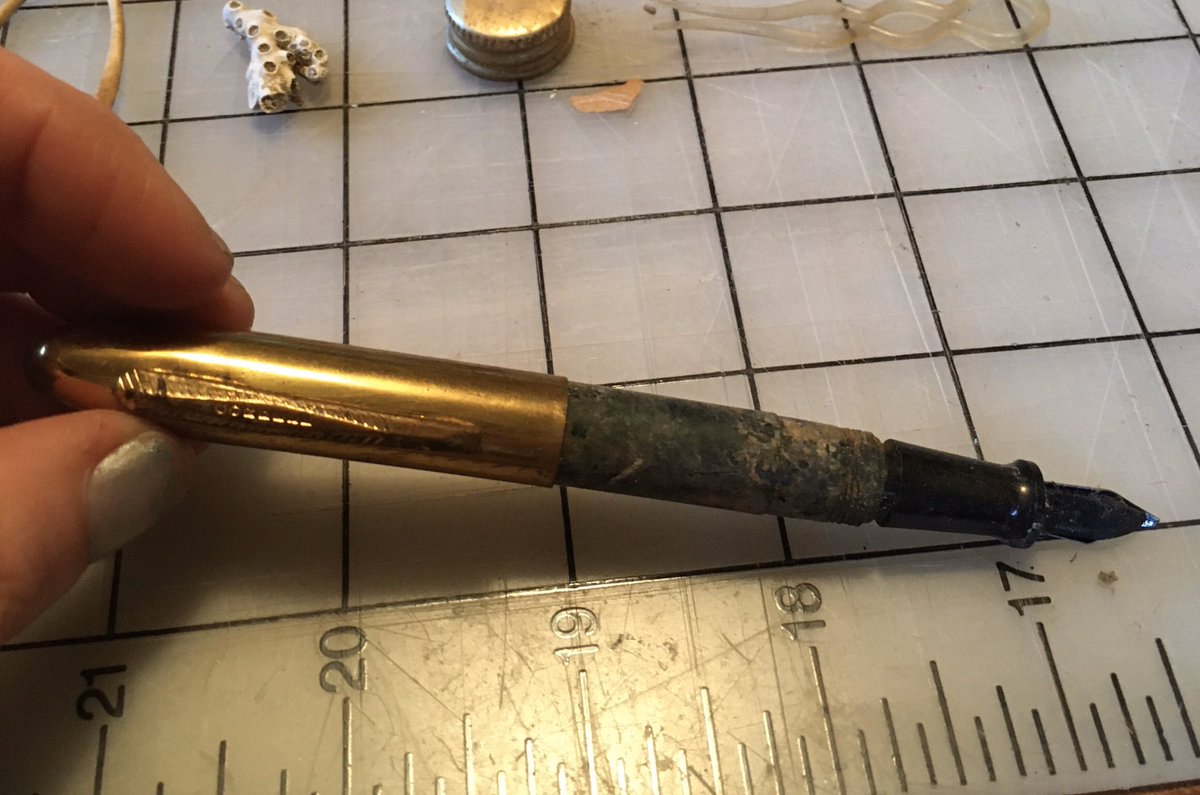 The pen is a c. 1930 Cordell fountain pen. It had some surface ashy residue which wiped clean with a dry cloth and a firm hand, but took zero force to remove fully and reveal a deep glossy pine green. The gold-tone cap fits smoothly.