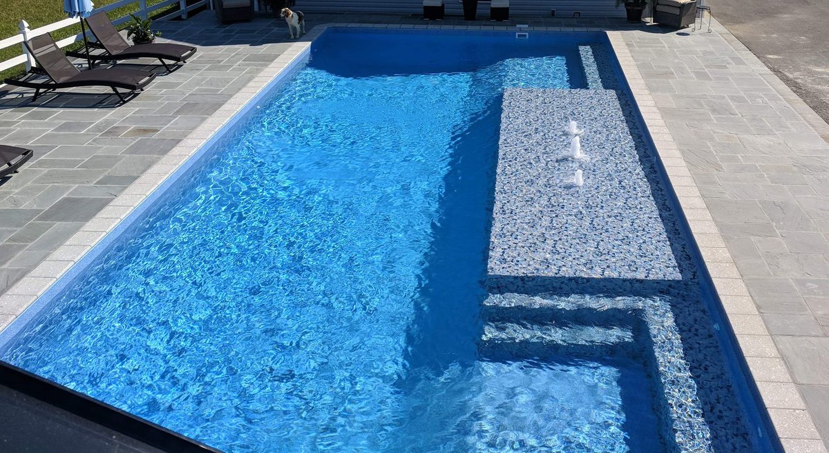 #TrueStoneTuesday Always impressed with the Mix &amp; Match combos of a TrueStone Pool!  We can't help it, whenever we scroll through our photo library - we always stop here! Pearlstone Feature with Gunite Light Blue #glipoolproducts #custompool #summer