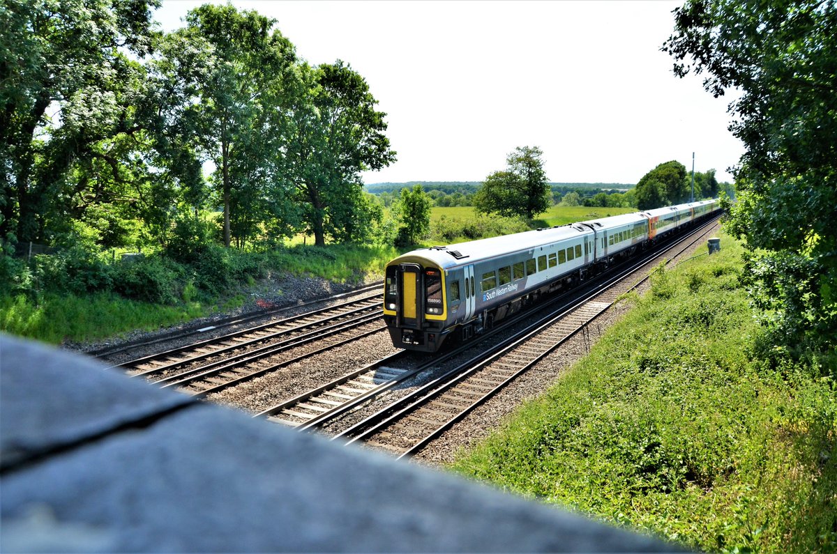 TheRealStavioni's tweet image. @SW_Help 158890 leads another pair of 158s and 159103 through Potbridge with 1L50, the 14.47 Salisbury to London Waterloo service. Sort of arty framing leaving the bridge in - seemed a good idea! #Class158 #Class159 #Sprinter #SWR #Rail #Train