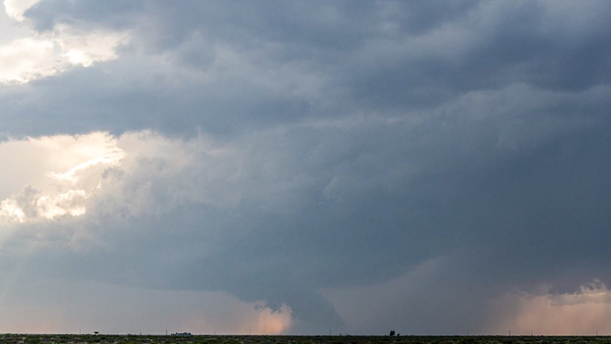 553pm MST After driving west directly into the sun, I finally roll under an anvil. Egads! It looks like there's already circulation! Scud bomb? A funnel? Was it on the ground? I can't be sure... you be the judge.