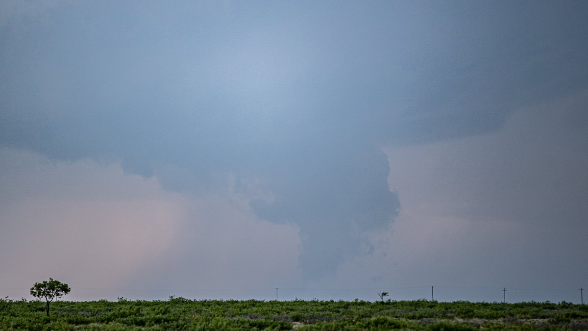 553pm MST After driving west directly into the sun, I finally roll under an anvil. Egads! It looks like there's already circulation! Scud bomb? A funnel? Was it on the ground? I can't be sure... you be the judge.