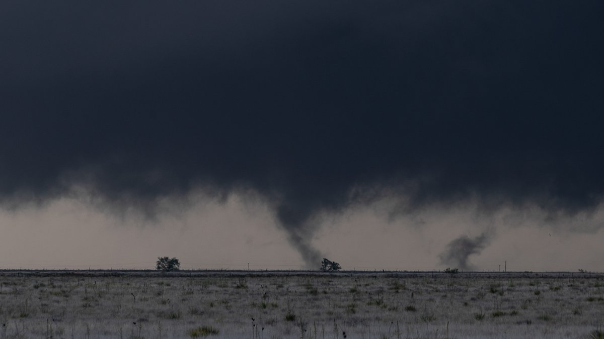 825pm MST After two cycles and attempts, a new groundscraping wall cloud forms, obsucring cell towers. A multivortex tornado forms.