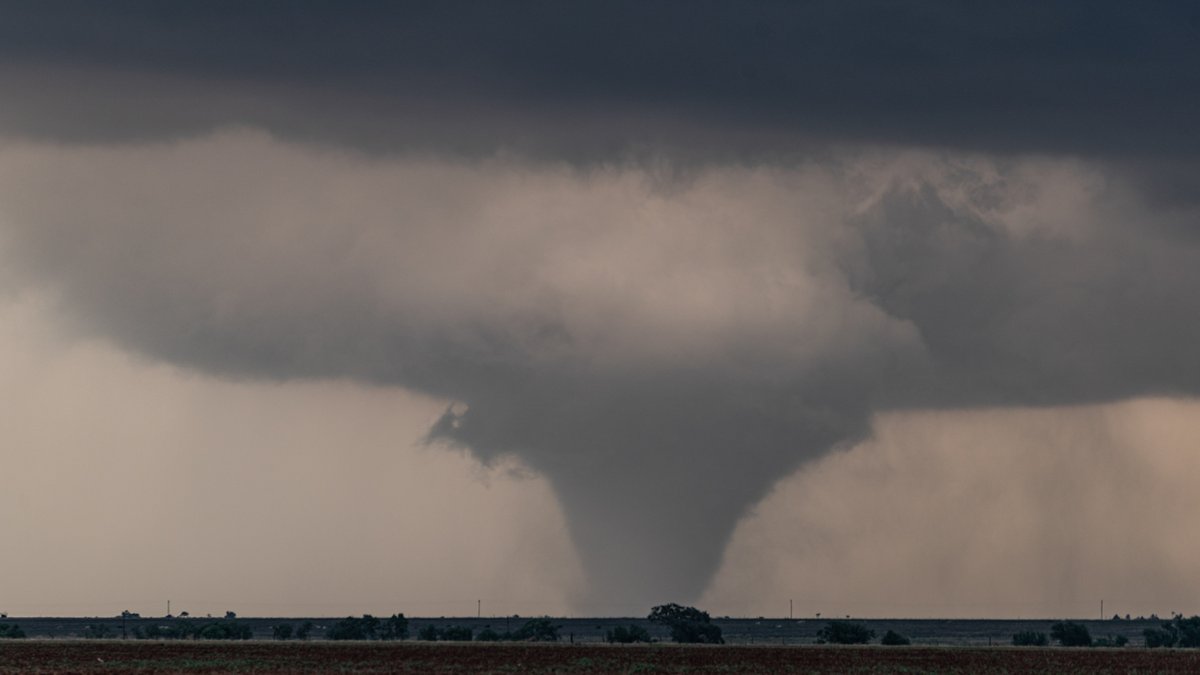 843pm MST The tornado has been spinning for ten minutes and begins to take a cone shape for another 15 minutes. The RFD cut, the inflow, the tornado, the entire scene is mesmerizing... and there seems to be a completely balanced maintenance of the storm.