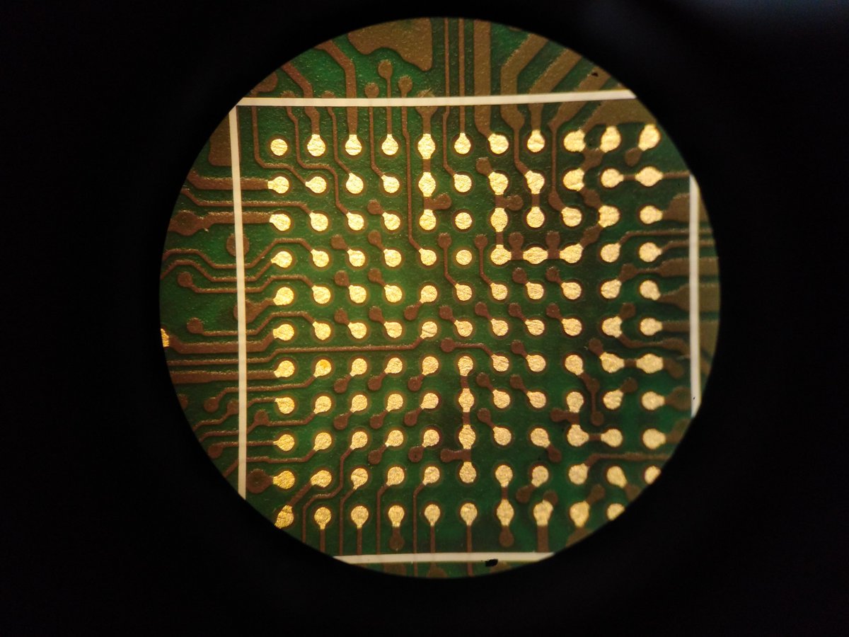 Close ups of the PCB: We were happy to see that the solder mask defined pads of the 0.5 mm BGA were looking good. If you look closely you can see that two pads are slightly smaller so the via-in-pad of another pad could be offset by a tiny but necessary amount.  @card10badge