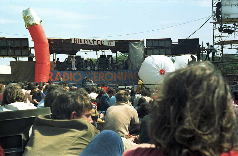 in all the elegant BBC film from this gig featured in  @longstrangedoc, i don’t recall any sustained wide-angled shot of the stage, which festival organizers seem to have adorned with giant inflatable schlong & breasts? must be that british wit. [8/11]