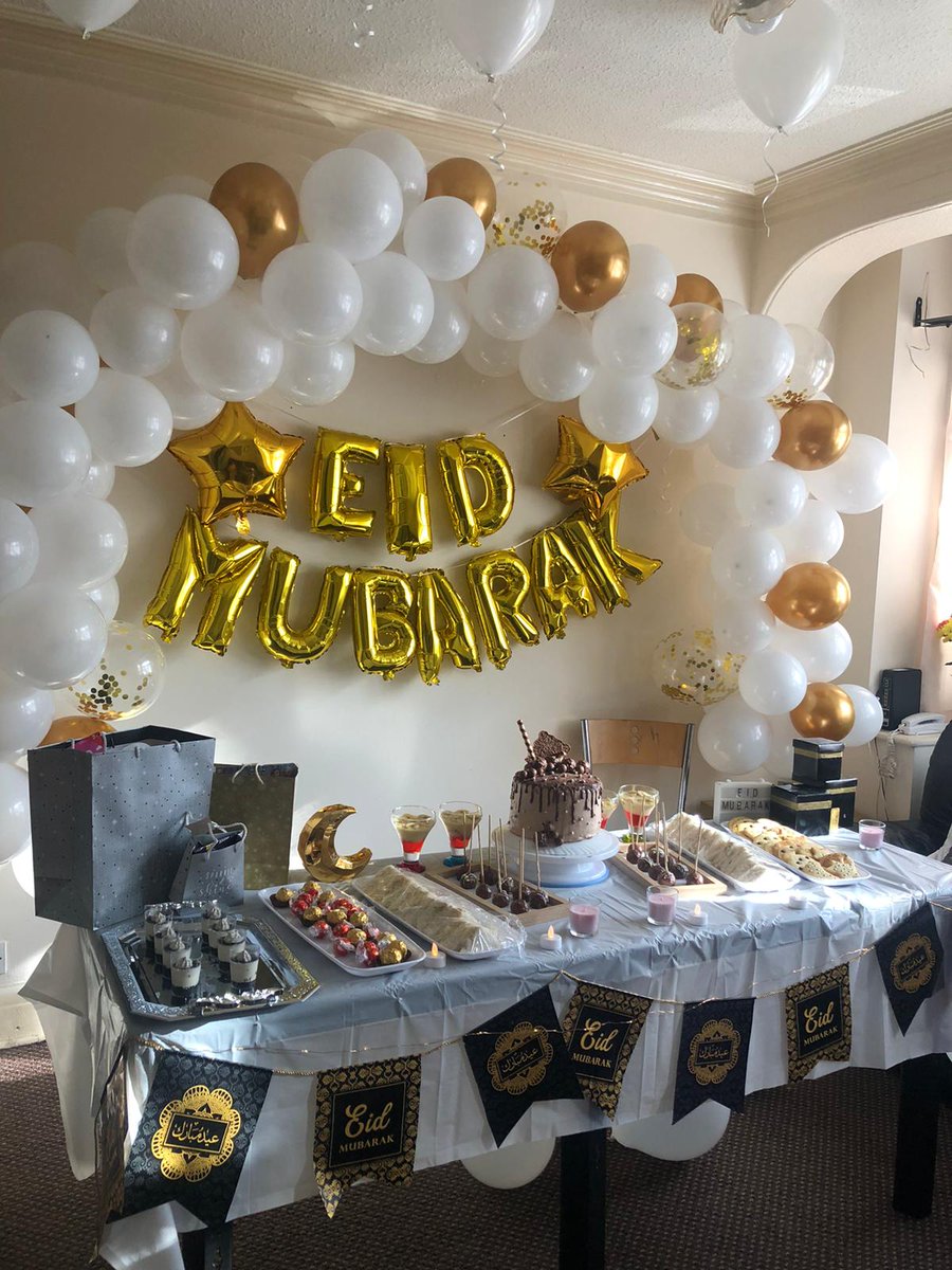 decorations !!! we put sm effort and time into this omg. we put eid mubarak balloons, a balloon arch with white, golden and confetti balloons, star balloons, balloons ok the ceiling, eid mubarak banner, a light box that says eid mubarak, and a moon table decoration