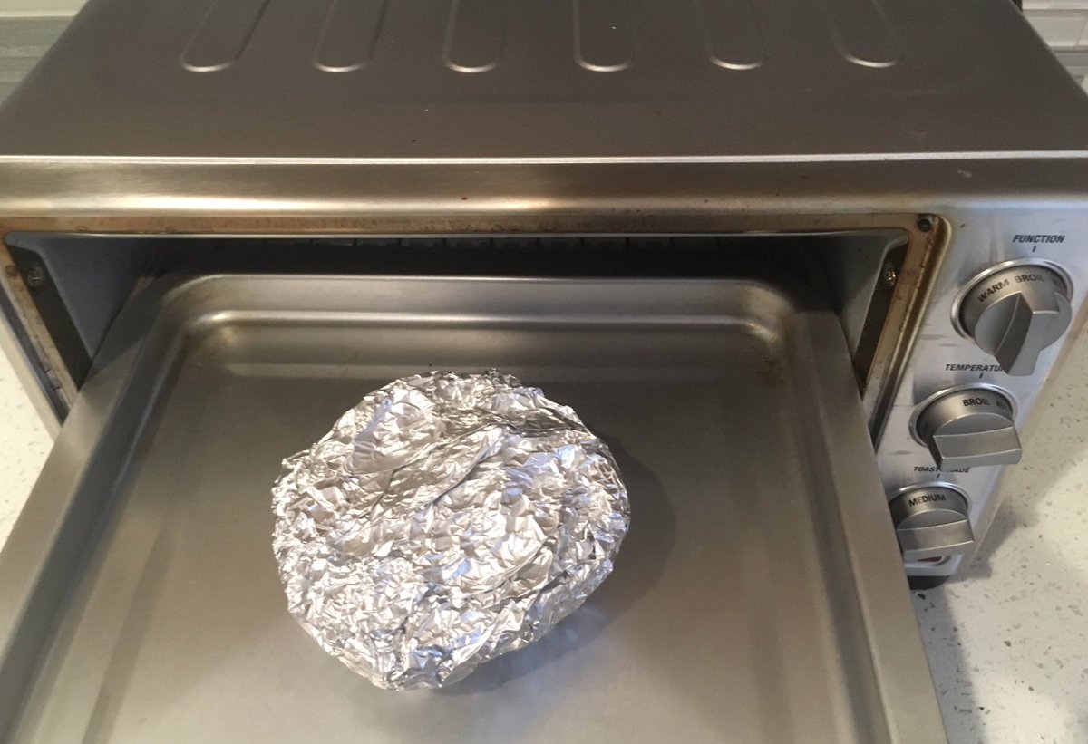 10) wrap it all up in a nice little pillow packet11) here I drastically diverged from RPat’s method, and actually put the tinfoil wrapped monstrosity into the toaster oven instead of the microwave. I’m not made of microwaves.12) broil for 15-20 minutes, then allow to cool