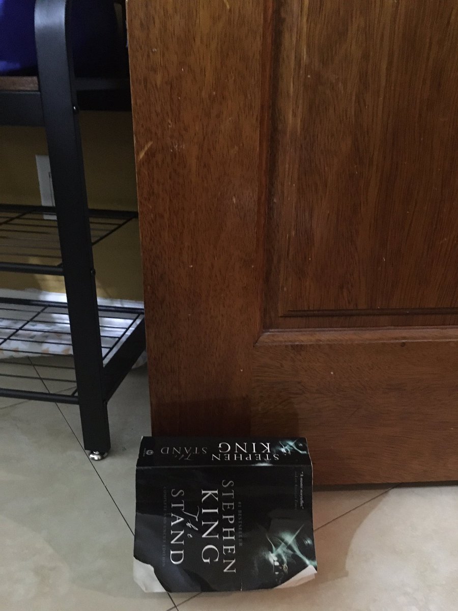 Gap under the door is too big for a regular doorstop. Good thing I just finished The Stand by <a href="/StephenKing/">Stephen King</a> and can have a such a topical doorstop instead! Also glad I already finished it versus starting it now because maybe I’d lose my mind (more than I already am).