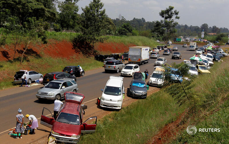 A general view shows vehicles parked and used as alternative mobile grocery stalls along the highway, following a lockdown due to the coronavirus disease (COVID-19) outbreak, on the outskirts of Nairobi, Kenya