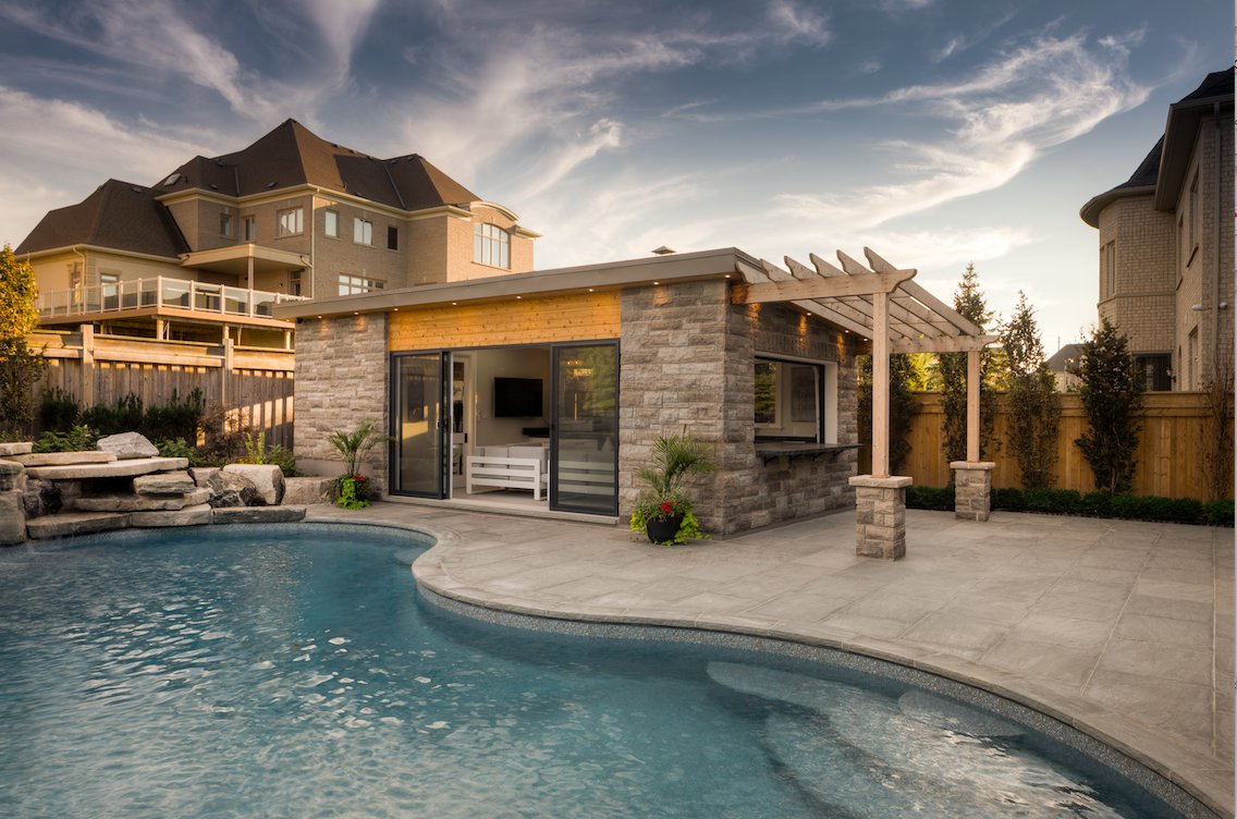 thepoolcraftco's tweet photo. Happy Monday! 

To start the week off right, we thought we'd share a look at this memorable pool, patio, and cabana combo we helped bring to life for some fantastic clients. 

What's your favourite part of this design?

#PoolCraft #LandscapeDesign #Backyard #Pool #Cabana #Patio https://t.co/rEv99PrEMD