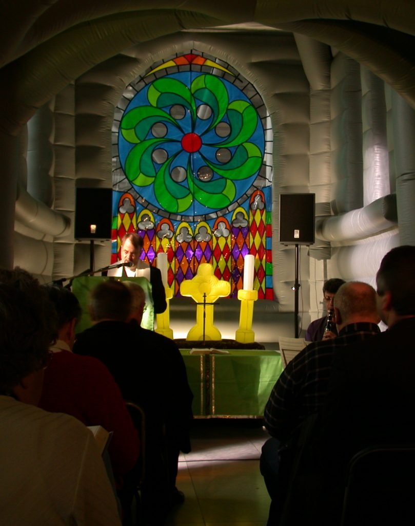 Yes of course an inflatable church comes with an inflatable altar and inflatable candlesticks in front of an inflatable stained glass window. What did you expect?