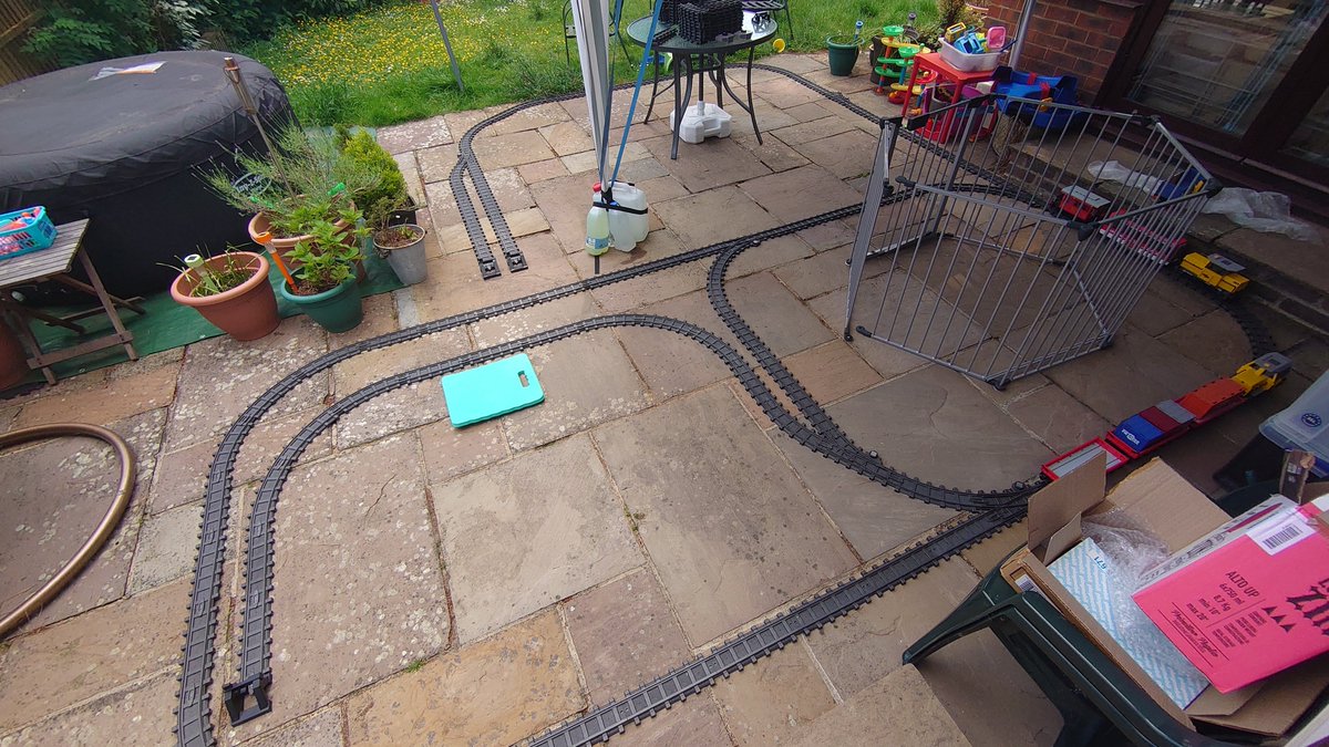 Used about half the track stock Need to leave space for TeenyActions playpen and the outside table. Main terminus at the top, goods transfer yard in the foreground.
