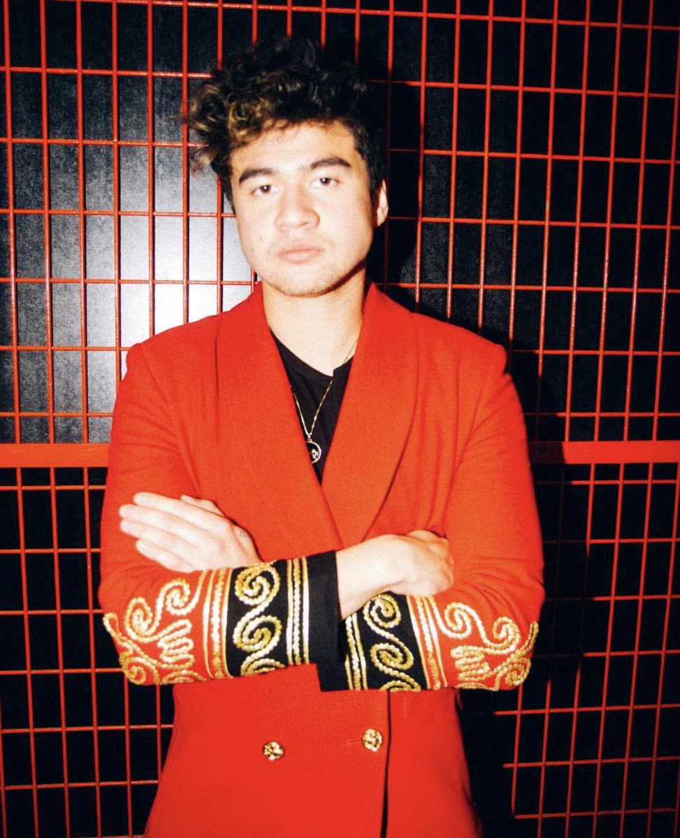 calum hood wearing colourful clothes; a thread