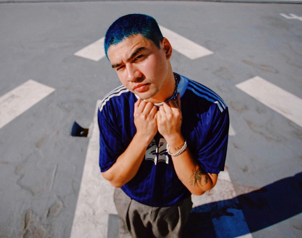 calum hood wearing colourful clothes; a thread