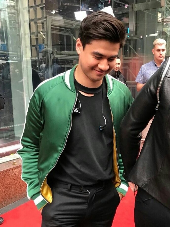 calum hood wearing colourful clothes; a thread