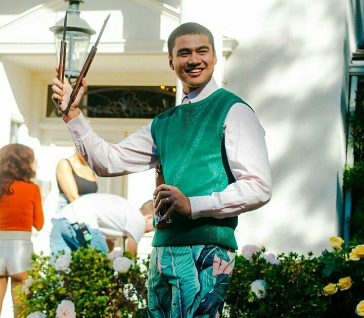 calum hood wearing colourful clothes; a thread