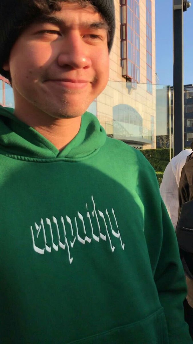 calum hood wearing colourful clothes; a thread