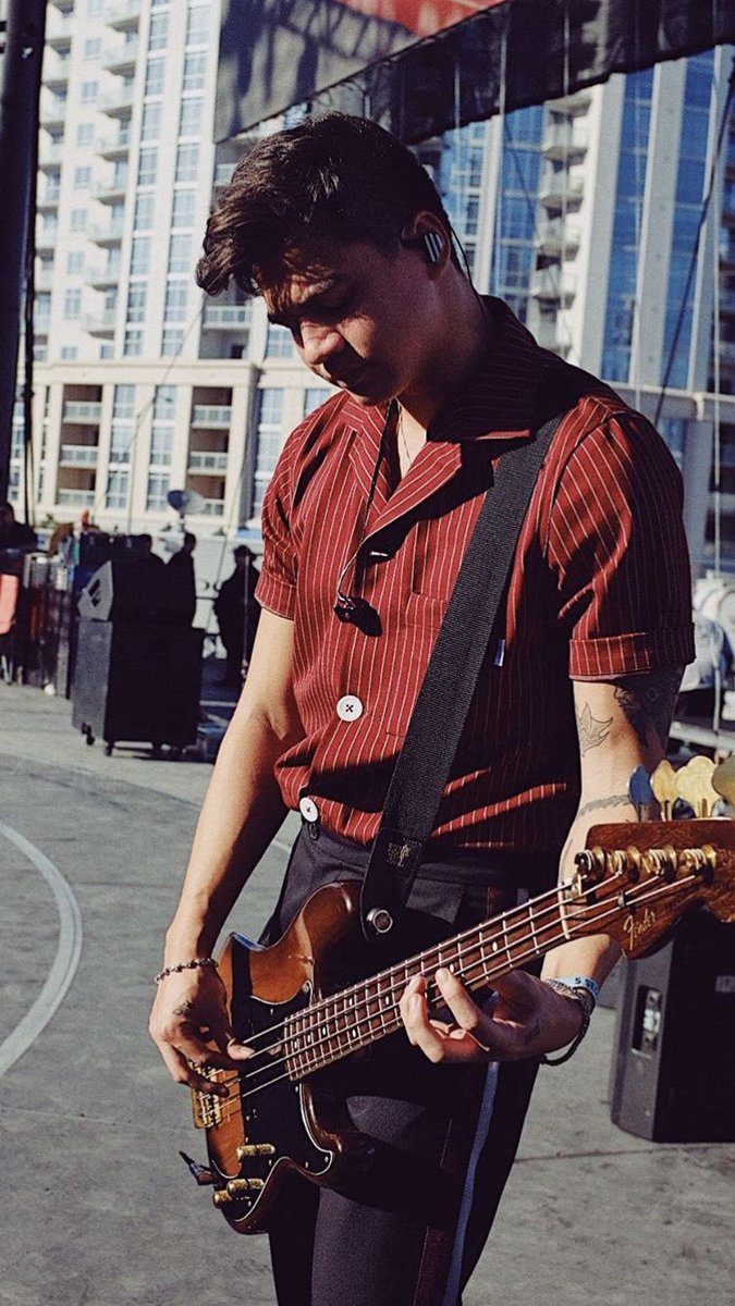 calum hood wearing colourful clothes; a thread