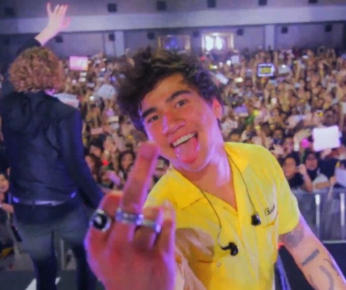 calum hood wearing colourful clothes; a thread