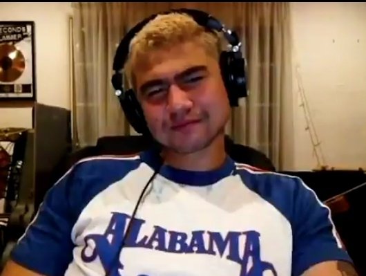 calum hood wearing colourful clothes; a thread