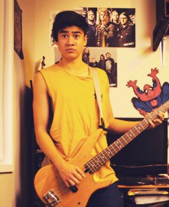 calum hood wearing colourful clothes; a thread